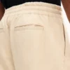 Pantalones elásticos de algodón con diseño en espiga Pantalones elásticos de algodón con diseño en espiga